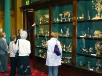 Sheffield Plate.  A display cabinet in the room adjacent to the drawing room and reception room containing silver presented to the Cutlers' Hall by Master Cutlers during their period of office. The left hand cabinet contains articles made from Sheffield Plate, consisting of a layer of copper sandwiched  between two layers of silver.