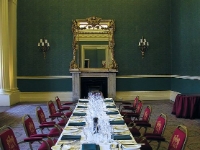 Dinner Is Served.  A table laid for dinner in an anti-room off the drawing and reception room. Twelve business men dine here on a regular basis to celebrate various occasions such as their birthdays.