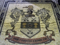 The Mosaic Crest And Motto.  This mosaic of the coat of arms  is in the floor of the foyer looking towards the grand staircase.