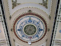 The Ceiling Of The Grand Hall.  A view of part of the ceiling , showing the centre chandelier in the Grand Hall.